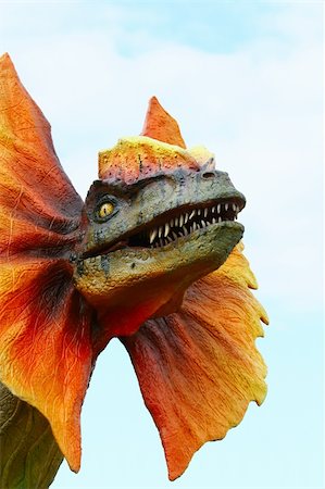 scary animal mouth - Dilophosaurus dinosaur with orange collar Stock Photo - Budget Royalty-Free & Subscription, Code: 400-04865316