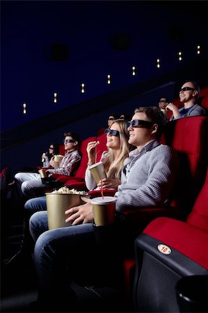 Smiling people in 3D glasses in cinema Stock Photo - Budget Royalty-Free & Subscription, Code: 400-04865870
