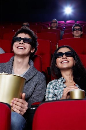 Laughing couple in 3D glasses in cinema Stock Photo - Budget Royalty-Free & Subscription, Code: 400-04865871