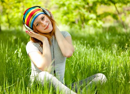 rastafarian - Redhead girl with headphone at green grass. Stock Photo - Budget Royalty-Free & Subscription, Code: 400-04865943