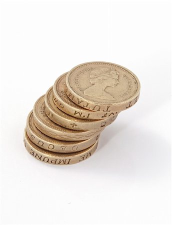 piles of cash pounds - British, UK, pound coins on a plain white background. Photographie de stock - Aubaine LD & Abonnement, Code: 400-04866090