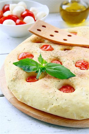 simsearch:400-04376706,k - Italian Focaccia bread with tomatoes and basil on a cutting board Stock Photo - Budget Royalty-Free & Subscription, Code: 400-04866234