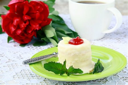 small cake on a plate with a cup of coffee elegant still life Stock Photo - Budget Royalty-Free & Subscription, Code: 400-04866565