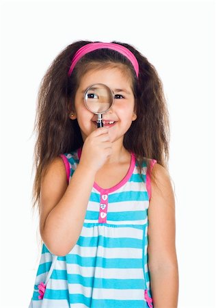 Beautiful little girl looking through a magnifying glass Stock Photo - Budget Royalty-Free & Subscription, Code: 400-04866748