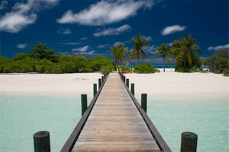 endhals (artist) - jetty leading to a tropical island Fotografie stock - Microstock e Abbonamento, Codice: 400-04867594