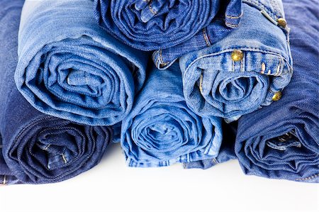 Rolls of Blue Jeans isolated on white background with copy space for your text Photographie de stock - Aubaine LD & Abonnement, Code: 400-04867672