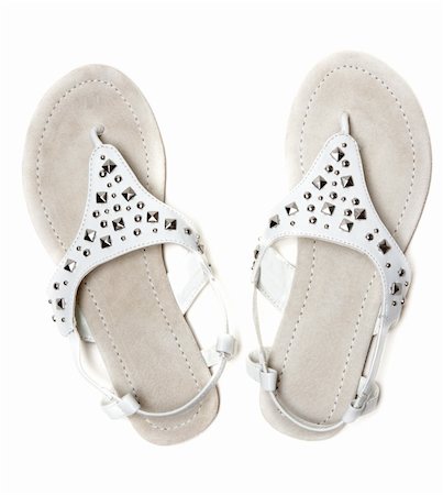 simsearch:400-07995083,k - Leather feminine sandals with steel button on white background Stock Photo - Budget Royalty-Free & Subscription, Code: 400-04867908
