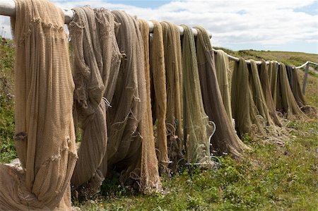 simsearch:400-05254289,k - Fishing networks to dry on wooden rack Photographie de stock - Aubaine LD & Abonnement, Code: 400-04867915