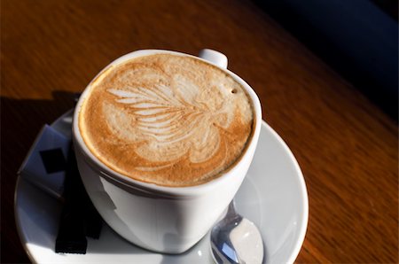 Cappuccino coffee cup closeup at the table Stockbilder - Microstock & Abonnement, Bildnummer: 400-04868005