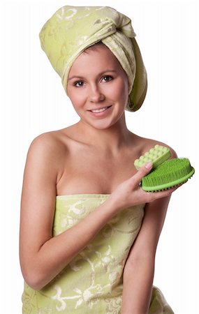 Beautiful girl in a green towel keeps bath means Hygiene on white background. Girl after shower Foto de stock - Super Valor sin royalties y Suscripción, Código: 400-04868376