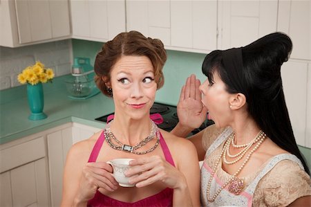 seniors and whispering - Retro styled woman whispers secret into friend's ear Stock Photo - Budget Royalty-Free & Subscription, Code: 400-04868692