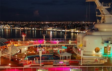 pool and cruise ship - Cruise ship deck under colrful night lights Stock Photo - Budget Royalty-Free & Subscription, Code: 400-04868795
