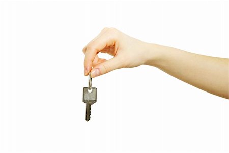 simsearch:400-05038040,k - hand holds a key isolated on white Photographie de stock - Aubaine LD & Abonnement, Code: 400-04869201