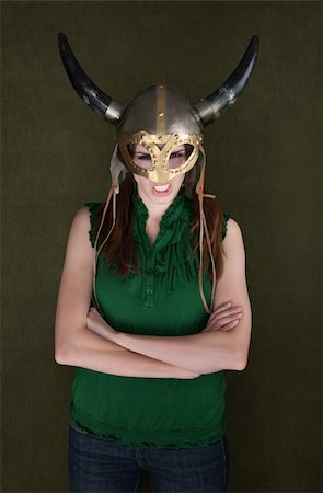 Angry woman with folded arms in Viking helmet Foto de stock - Royalty-Free Super Valor e Assinatura, Número: 400-04869539