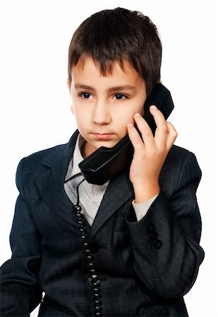 young boy talking on the phone isolated on white background Stock Photo - Budget Royalty-Free & Subscription, Code: 400-04869758