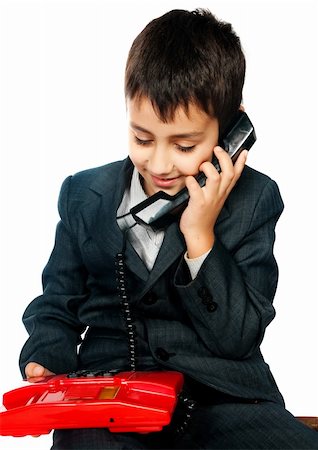 young boy talking on the phone isolated on white background Stock Photo - Budget Royalty-Free & Subscription, Code: 400-04869760