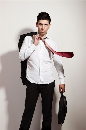 suit wind - Portrait of a young and fashion businessman over a white background Foto de stock - Super Valor sin royalties y Suscripción, Código: 400-04860007