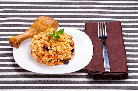 delicious couscous with chicken on a striped background Stock Photo - Budget Royalty-Free & Subscription, Code: 400-04860427