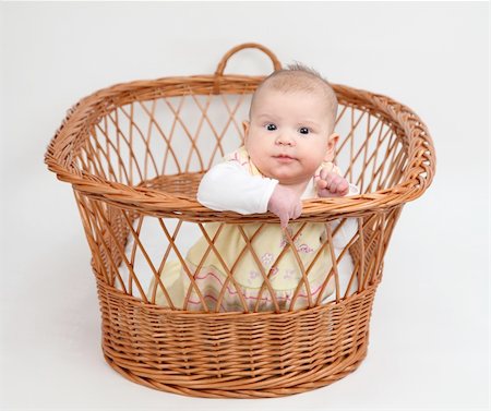 Little baby girl sitting in basket Stock Photo - Budget Royalty-Free & Subscription, Code: 400-04860422