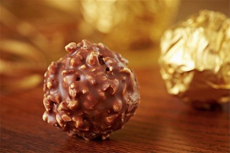 closeup of chocolate truffles on brown wooden table Stock Photo - Budget Royalty-Free & Subscription, Code: 400-04861582