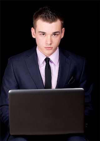 strotter13 (artist) - A photograph of a young executive sitting down with his laptop. Photographie de stock - Aubaine LD & Abonnement, Code: 400-04861801