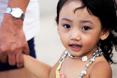 simsearch:400-05739745,k - Portrait of the beautiful small Asian girl with father. Indonesia. Java Stock Photo - Budget Royalty-Free & Subscription, Code: 400-04861920