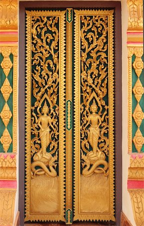 Buddhist temple door decoration in Paksong City, Champasak Province, Southern of Laos Stock Photo - Budget Royalty-Free & Subscription, Code: 400-04862103