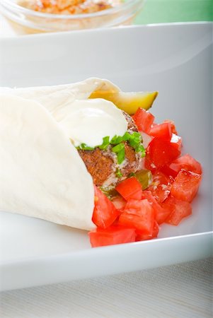 fresh traditional falafel wrap on pita bread with fresh chopped tomatoes Stock Photo - Budget Royalty-Free & Subscription, Code: 400-04862120