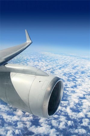 simsearch:400-04378611,k - airplane wing aircraft turbine flying blue sky white clouds Stock Photo - Budget Royalty-Free & Subscription, Code: 400-04862607