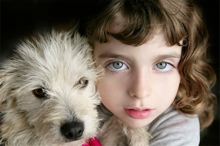 dog puppy and girl hug portrait closeup blue eyes white hairy little doggy Foto de stock - Royalty-Free Super Valor e Assinatura, Número: 400-04862633