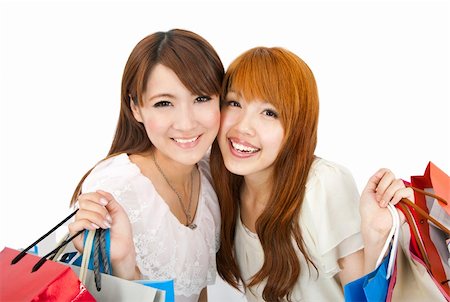 simsearch:400-04900515,k - happy young girls standing together with shopping bags Stock Photo - Budget Royalty-Free & Subscription, Code: 400-04862798