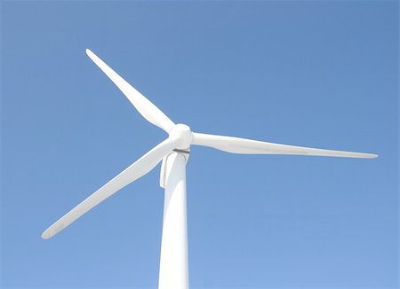 danicek (artist) - View of single windmill generating electricity against blue sky Foto de stock - Super Valor sin royalties y Suscripción, Código: 400-04862852