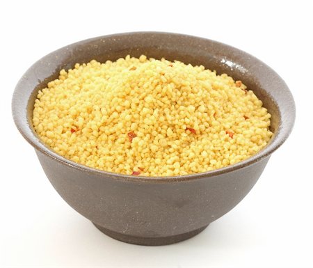 danicek (artist) - Close up view of couscous in brown bowl on white background Foto de stock - Super Valor sin royalties y Suscripción, Código: 400-04862862