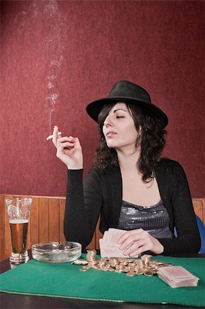 Smoker girl playing poker Stock Photo - Budget Royalty-Free & Subscription, Code: 400-04863131