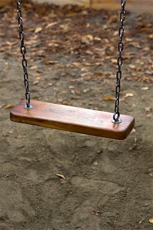 empty playground - A lonely swing in the silent park Stock Photo - Budget Royalty-Free & Subscription, Code: 400-04863392