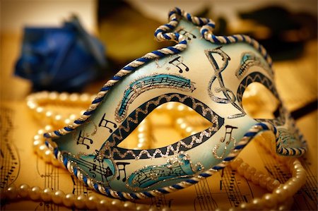 Ornate carnival mask on a music paper with rose and pearl Stock Photo - Budget Royalty-Free & Subscription, Code: 400-04863435