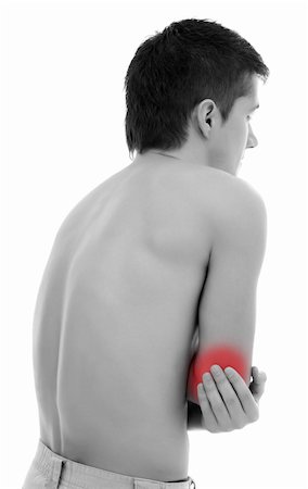 simsearch:400-06476910,k - Young man holding his elbow, having pain Stock Photo - Budget Royalty-Free & Subscription, Code: 400-04863442