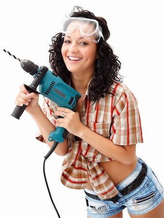 A young smiling female worker with a drilling machine Stock Photo - Budget Royalty-Free & Subscription, Code: 400-04863443
