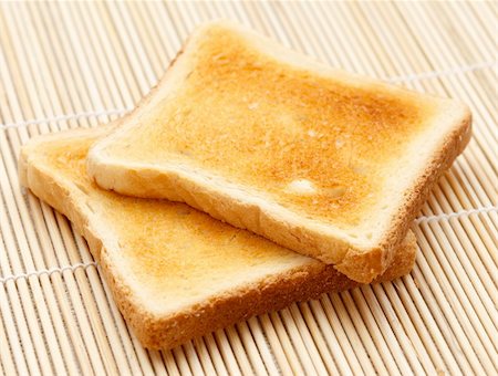 Two pieces of toast on the table Foto de stock - Royalty-Free Super Valor e Assinatura, Número: 400-04863479
