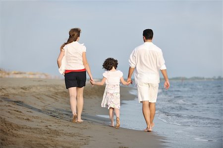 happy young family have fun and live healthy lifestyle on beach Stock Photo - Budget Royalty-Free & Subscription, Code: 400-04874428