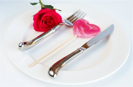 setting table flatware - Valentines day table setting with a white plate, single pink rose and heart shaped lolly Stock Photo - Budget Royalty-Free & Subscription, Code: 400-04874656