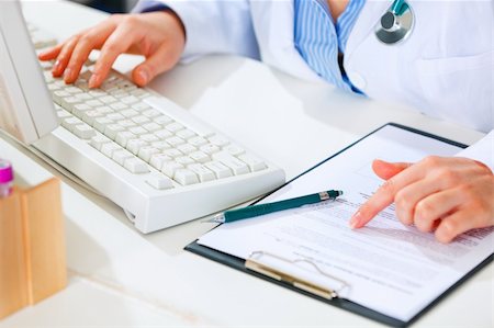 simsearch:400-04925813,k - Medical doctor woman working at office table. Closeup. Stock Photo - Budget Royalty-Free & Subscription, Code: 400-04874959