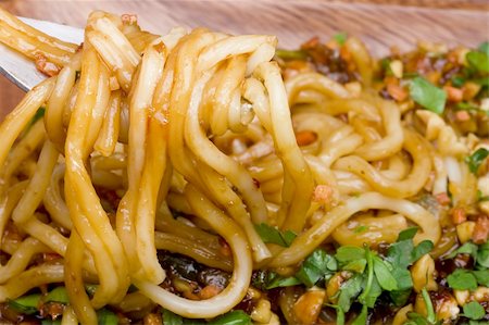 simsearch:400-04997357,k - Freshly prepared noodles on a silver fork. Photographie de stock - Aubaine LD & Abonnement, Code: 400-04875115