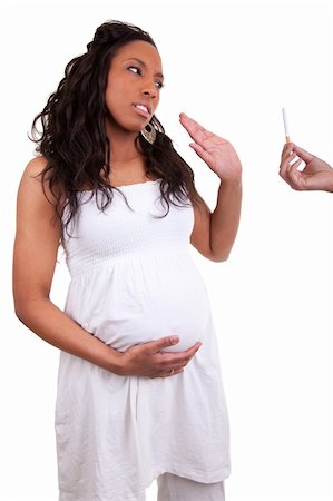 pregnant african american woman refusing a cigarette Foto de stock - Super Valor sin royalties y Suscripción, Código: 400-04875116