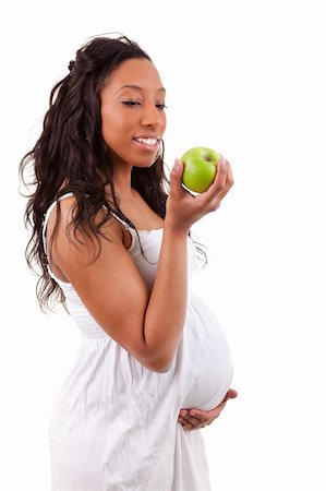 pregnant black woman eating an apple Stock Photo - Budget Royalty-Free & Subscription, Code: 400-04875113