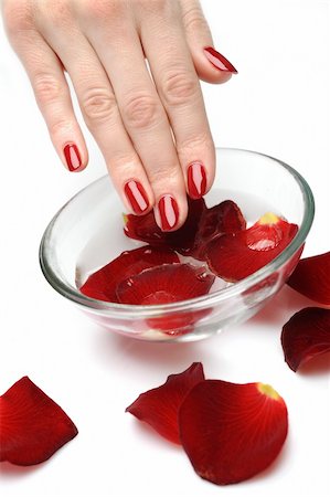 simsearch:400-06061806,k - Beautiful hand with perfect nail red manicure and rose petals. Stock Photo - Budget Royalty-Free & Subscription, Code: 400-04875251