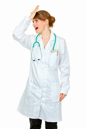 simsearch:400-04351236,k - Surprised medical doctor woman striking her forehead  isolated on white Stock Photo - Budget Royalty-Free & Subscription, Code: 400-04875493