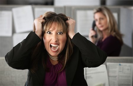 frustrated office worker with hands in hair - Frustrated female office worker in a cubicle pulls her hair Stock Photo - Budget Royalty-Free & Subscription, Code: 400-04875756