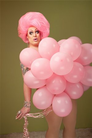 simsearch:400-04834980,k - Large woman with pink balloons on green background Stock Photo - Budget Royalty-Free & Subscription, Code: 400-04875764