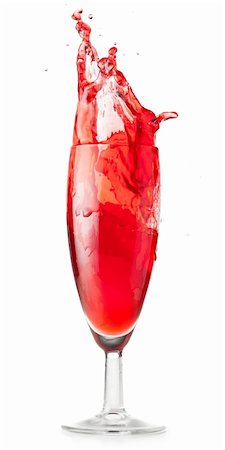 red liquid is splashing in glass cut out from white background Stock Photo - Budget Royalty-Free & Subscription, Code: 400-04876297